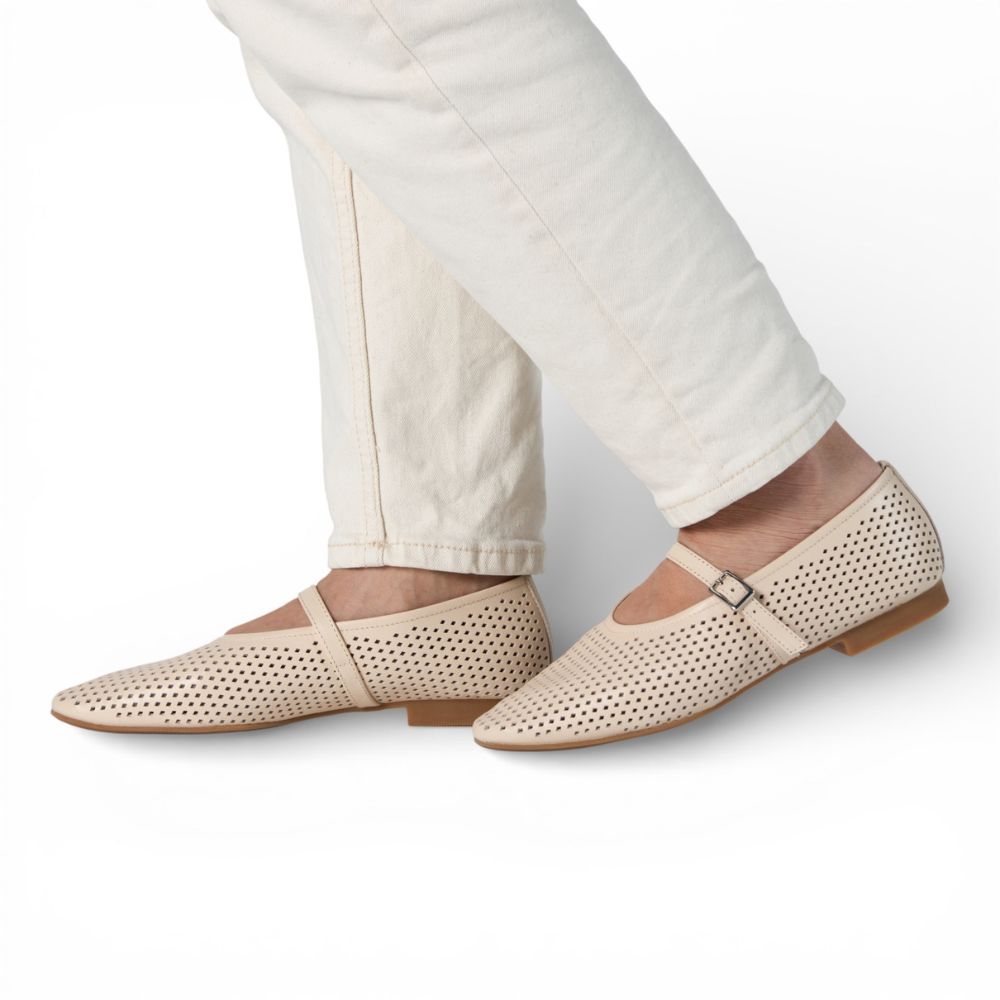 Richmond Bone Perforated Leather Mary Jane worn with light-colored pants on a white background