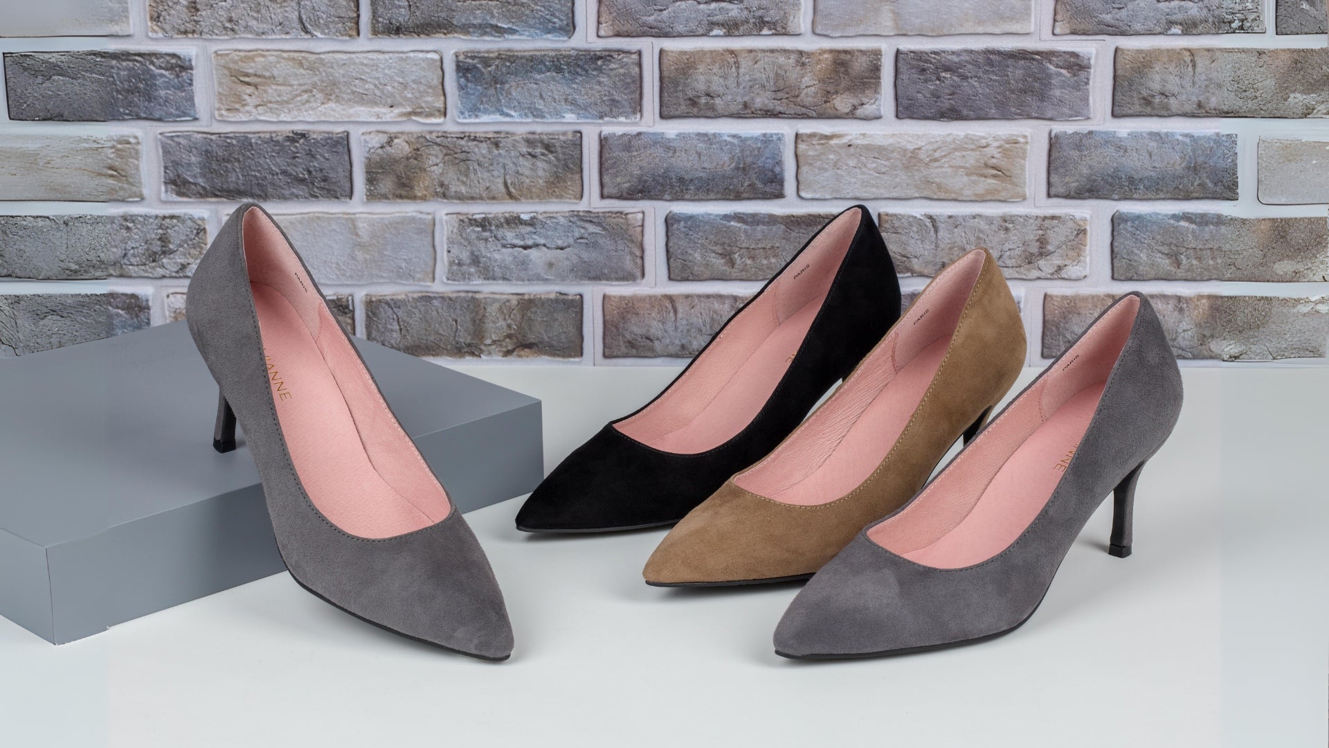 A collection of three colorful high heel pairs, each with distinct designs, arranged for a stylish presentation.