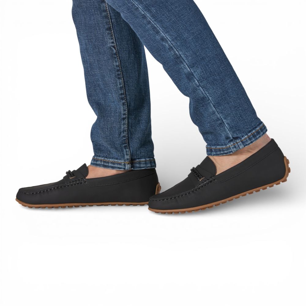 Madrid Black Gum Driver Moccasins with Rope Detail worn with blue jeans on a white background