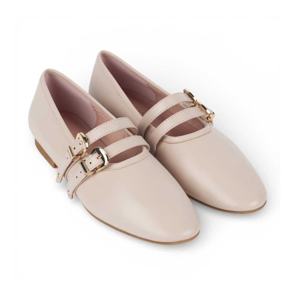 Pair of Dover Bone Leather Flat with Double Strap Detail with gold buckles on a white background