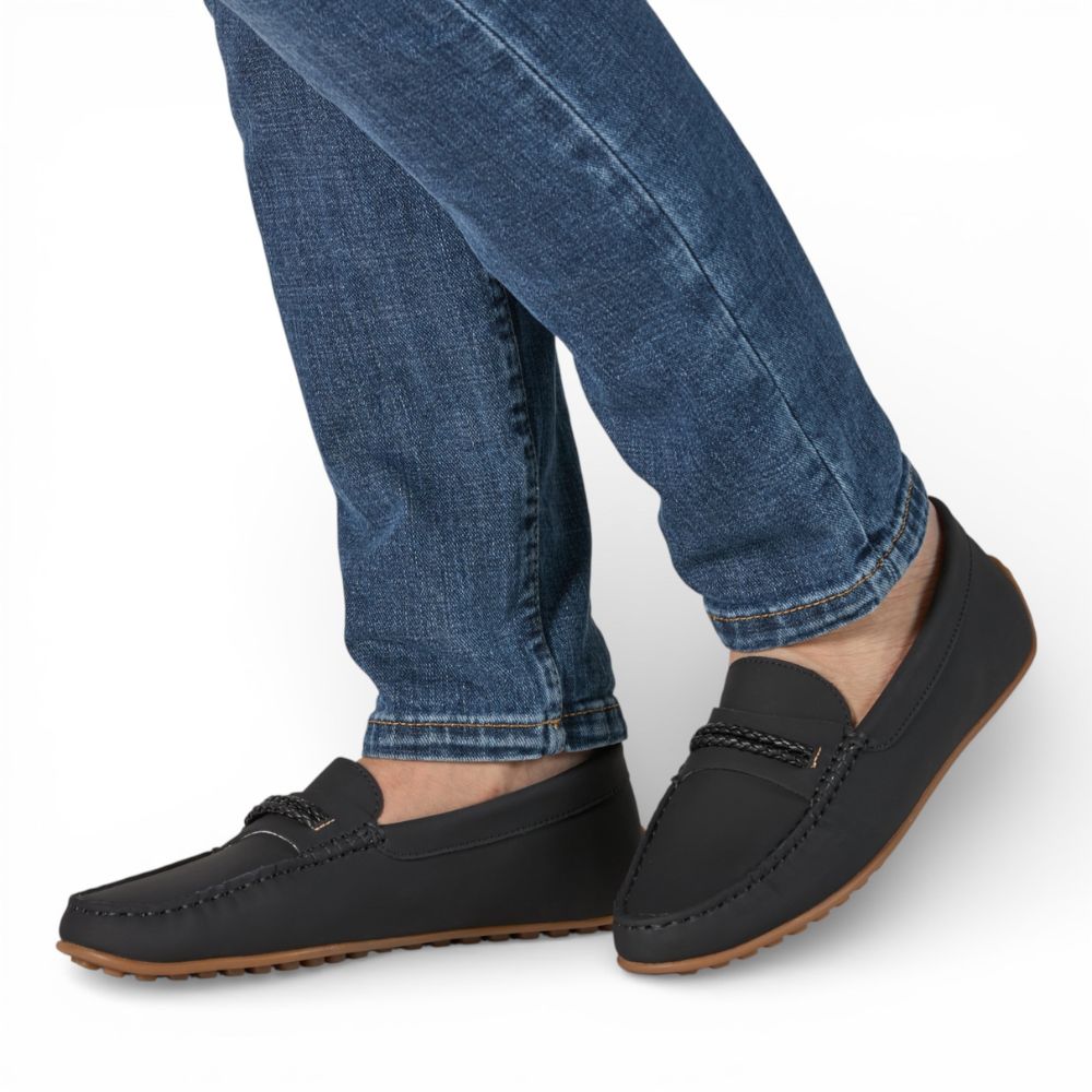 Madrid Black Gum Driver Moccasins with Rope Detail worn with blue jeans on a white background