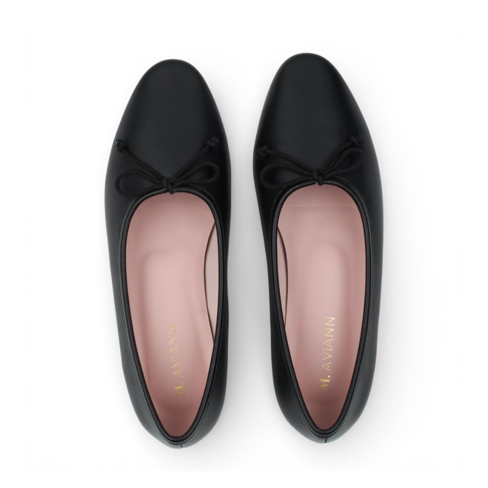 Roma Black Leather Elegant Flat with a bow on a white background