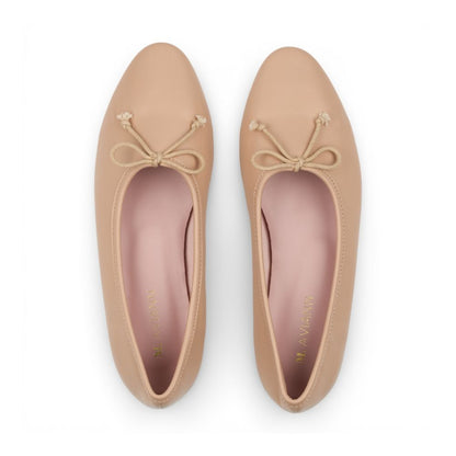 Pair of Roma Nude Leather Elegant Flat shoes with bow details on a white background