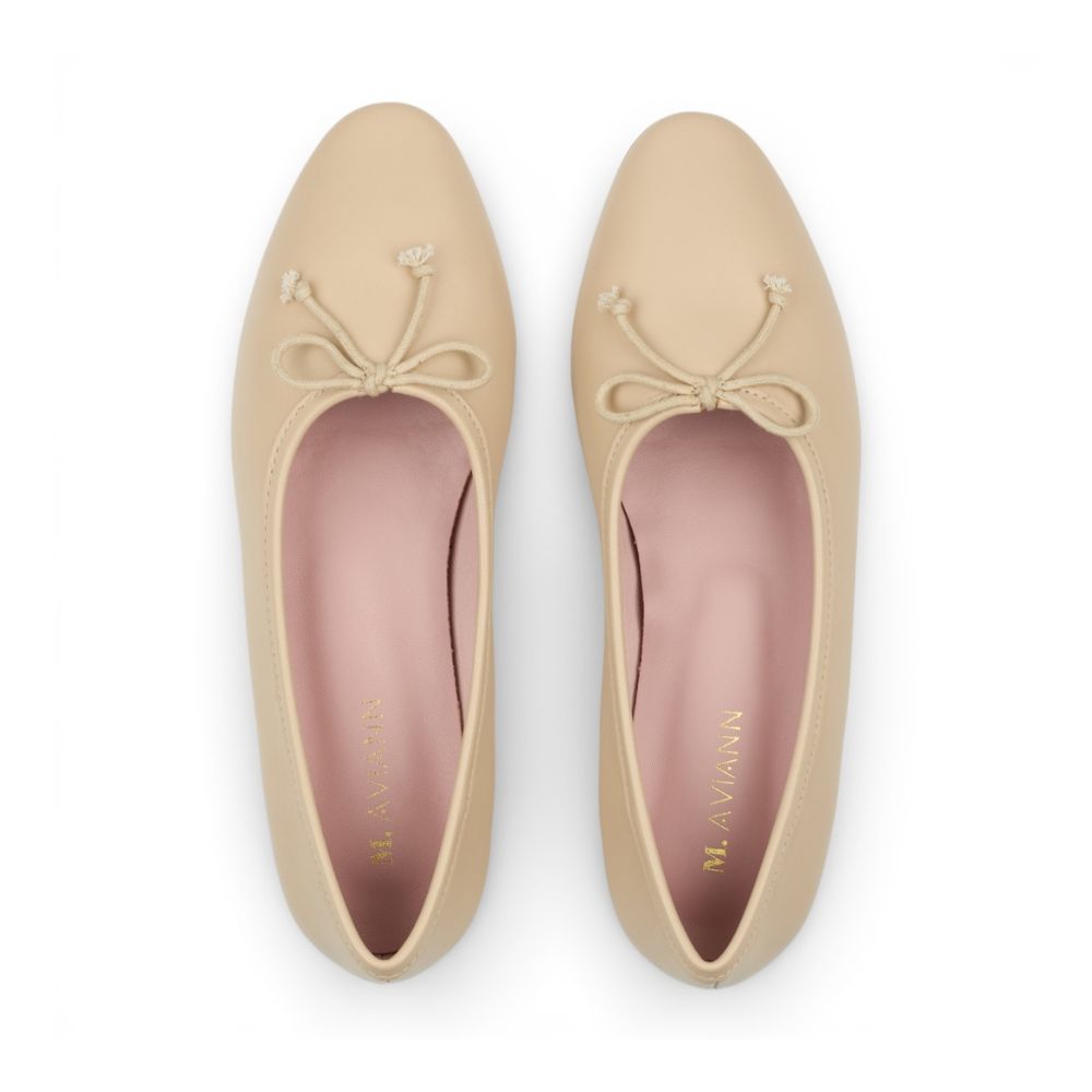 Pair of Roma Pearl Leather Elegant Flat shoes with bow details on a white background