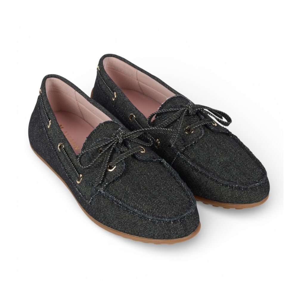 Pair of Sevilla Black Denim Boat Moccasins shoes with brown soles on a white background