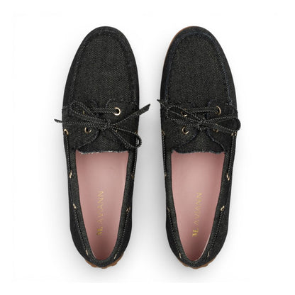 Pair of Sevilla Black Denim Boat Moccasins with pink insole on a white background