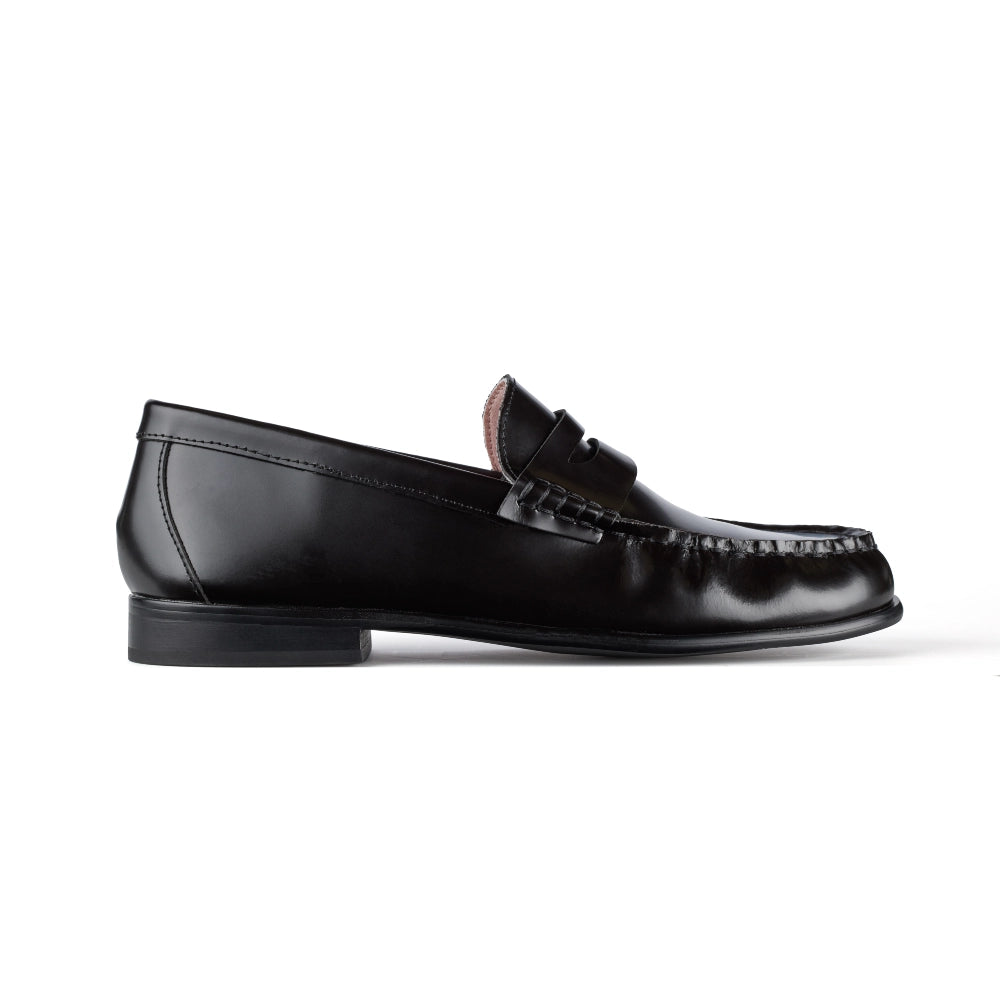 Side view of Buffalo Loafers in classic black, showcasing sleek design and comfort.
