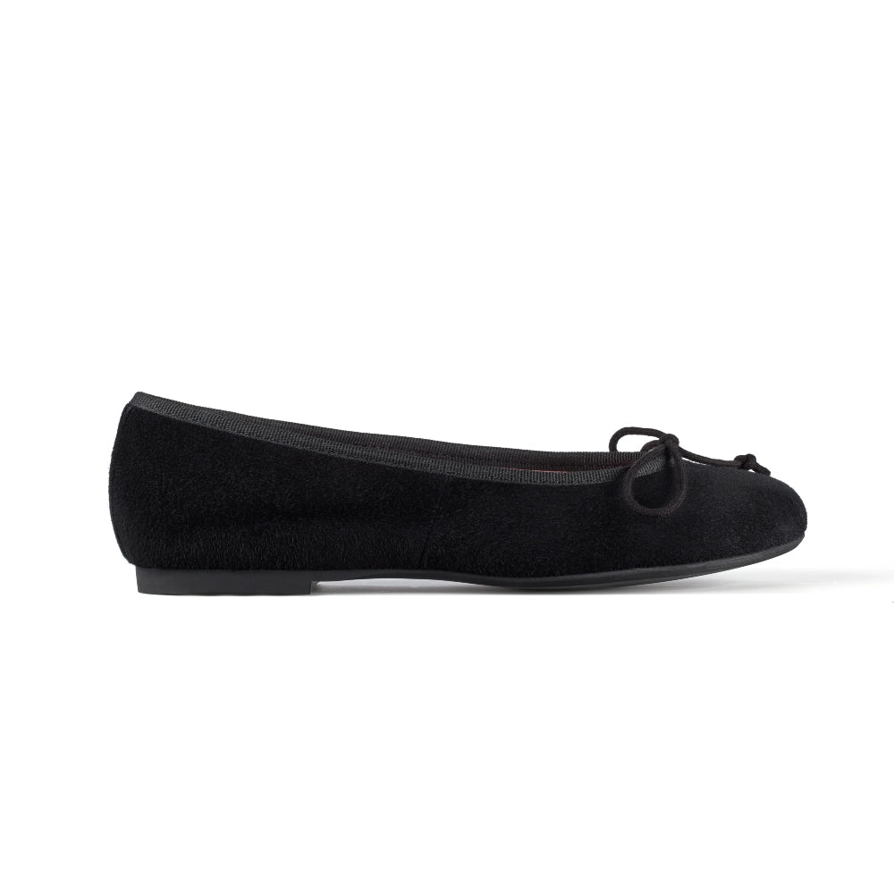 Side view of Concord Suede Flats in black, offering a sleek and classic design for every occasion.

